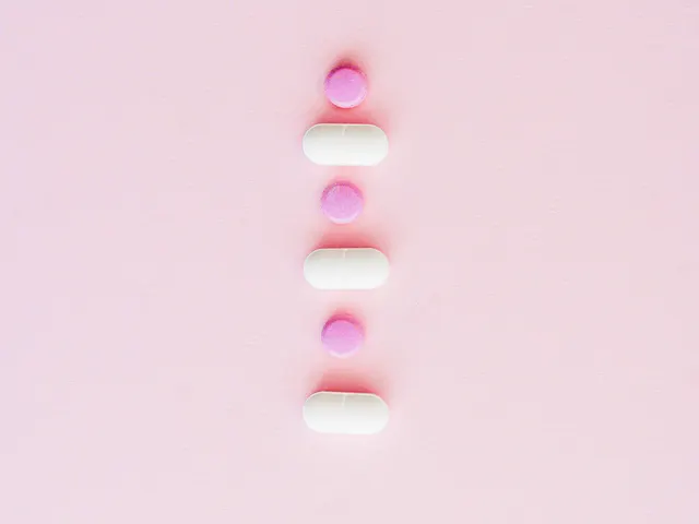 Evidence-based alternatives to HRT Pink and white tablets arranged on a pale pink surface